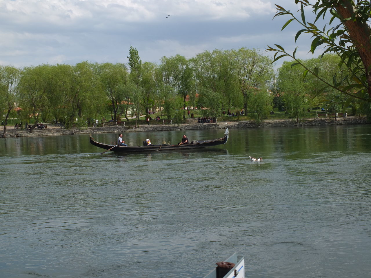 MAN ON BOAT AGAINST SKY