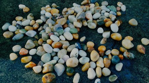 High angle view of pebbles on pebble beach