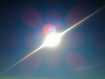 Low angle view of sun in sky