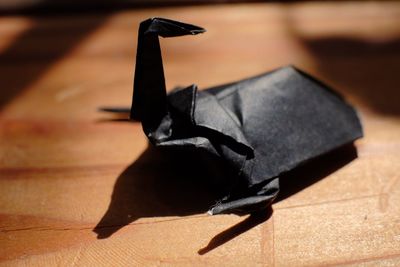 Close-up of black paper on table