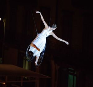 Woman jumping in a traditional clothing