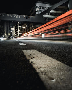 Light trails on road in city at night