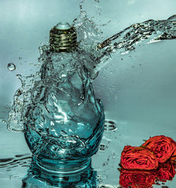 Close-up of water splashing on glass