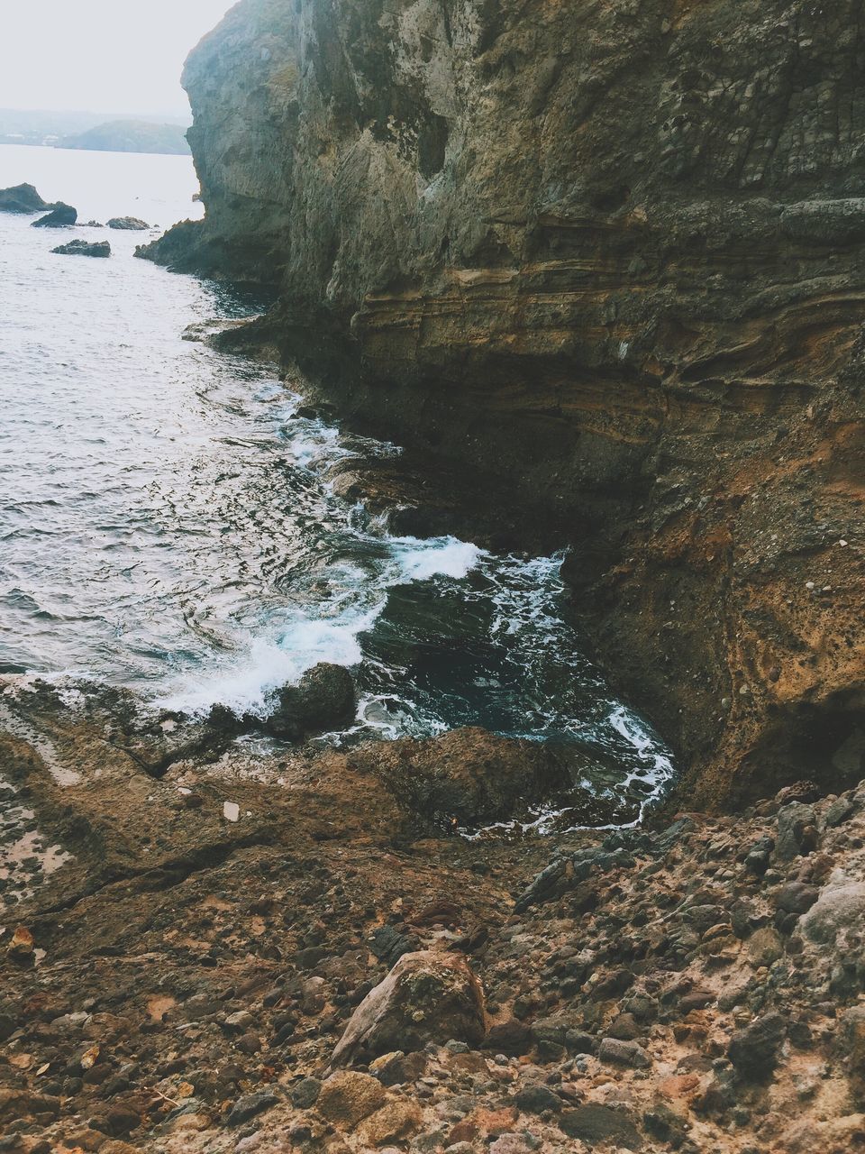 water, tranquility, sea, tranquil scene, scenics, beauty in nature, nature, beach, shore, reflection, rock - object, sky, idyllic, rock formation, remote, non-urban scene, coastline, lake, outdoors, day