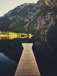 Pier over lake against sky