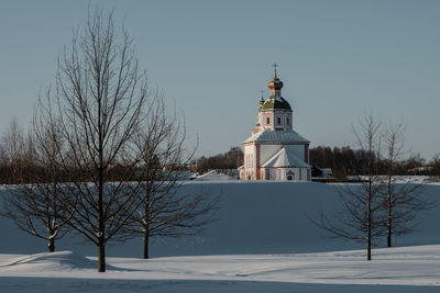 House on snow covered landscape