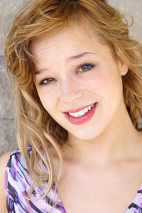 Portrait of smiling young woman standing outdoors