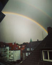 Rainbow over city