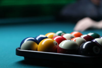 Close-up of pool ball on table