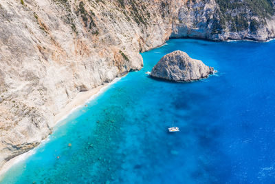 High angle view of rock formations in sea