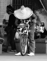 Portrait of people sitting on street in city