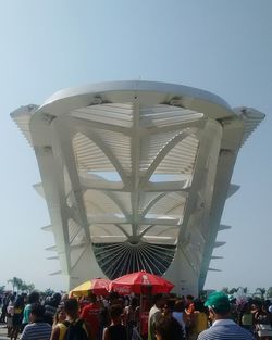 People at town square against clear sky