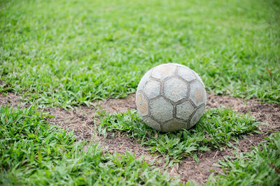 Close-up of soccer ball on field