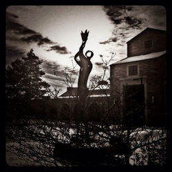 Statue of liberty against cloudy sky