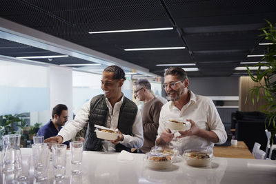 Group of business people during lunch break in office