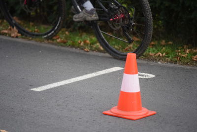 Bicycle sign on road in city