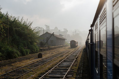 Train on railroad tracks against sky