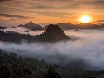 Scenic view of mountains against sky during sunset