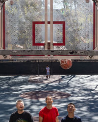 Men with basketball hoop
