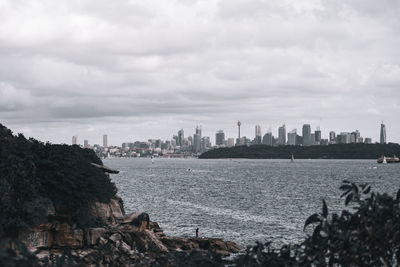 Panoramic view of sea and buildings against sky
