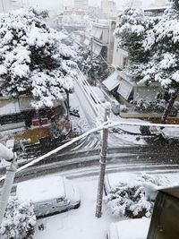 Snow covered houses and buildings in city