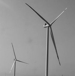 Low angle view of windmill against clear sky