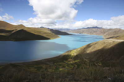 Scenic view of lake and mountains against sky