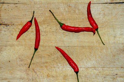 High angle view of red chili peppers on table