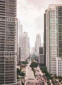 High angle view of buildings amidst road in city