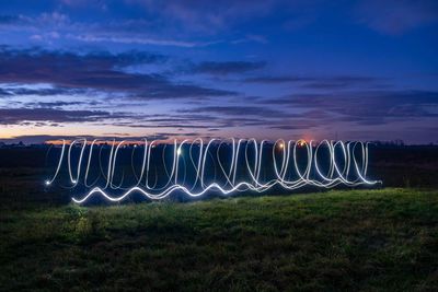 Scenic view of field against sky at night