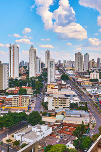 High angle view of buildings in city against sky