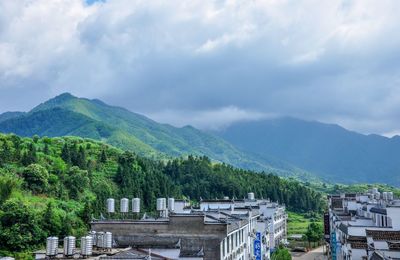 High angle view of trees and mountains against sky