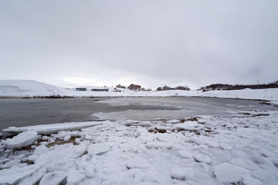 Scenic view of snow covered landscape against clear sky