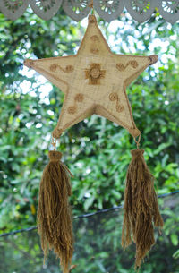 Close-up of christmas decorations hanging on tree