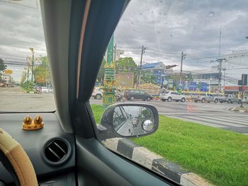 Bicycle on road seen through car window