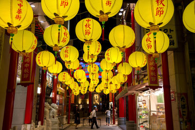 Illuminated lanterns hanging in city at night