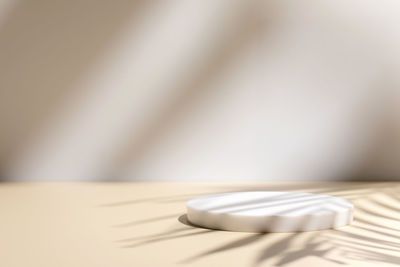 Scene with circle podiums on beige background and shadows