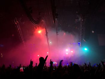 People enjoying music concert at night