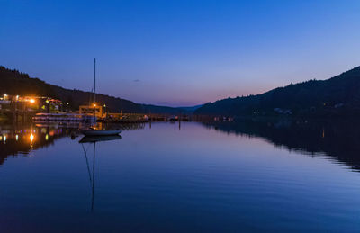 Scenic view of lake against sky at dusk