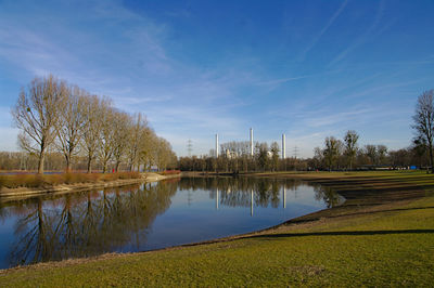 Scenic view of lake against blue sky