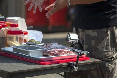 Mid section of a man preparing food