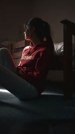 Young woman sitting on chair