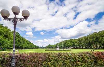 Street lights in park against sky