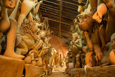 Low angle view of statues in temple during durga pooja in delhi