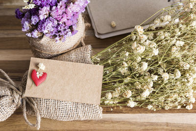 Close-up of flower bouquet against white wall