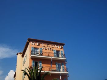 Low angle view of built structure against clear blue sky