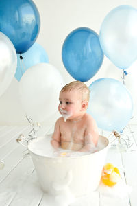 Boy looking at balloons