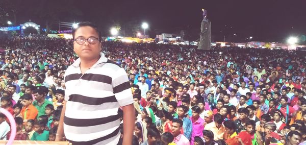 High angle view of people wearing sunglasses standing at night