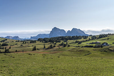 Scenic view of landscape and mountains against sky