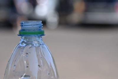 Plastic water bottle closeup with cap off showing the twist top